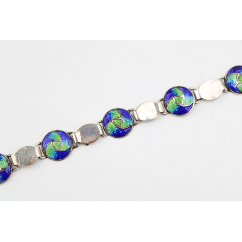 492 - An Art Nouveau silver and enamel bracelet, by Stainton Brothers, set with seven enamelled roundels i... 