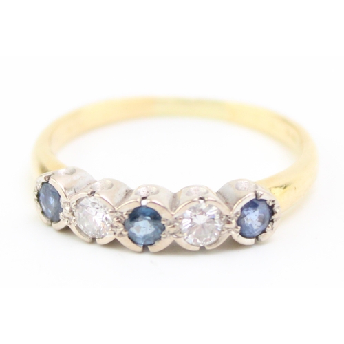 495 - An 18ct gold, diamond and sapphire five stone ring, set with two diamonds and three dusty cornflower... 