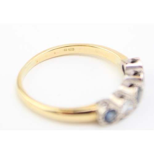 495 - An 18ct gold, diamond and sapphire five stone ring, set with two diamonds and three dusty cornflower... 