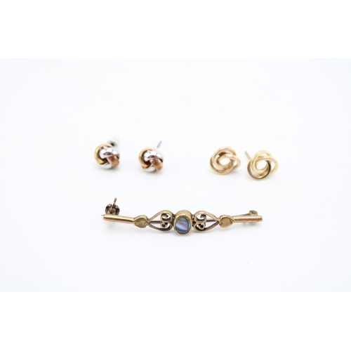 499 - A pair of 9ct gold knot earrings, 1.1g, a pair of tricolour knot earrings, unmarked 3.0g and an unma... 