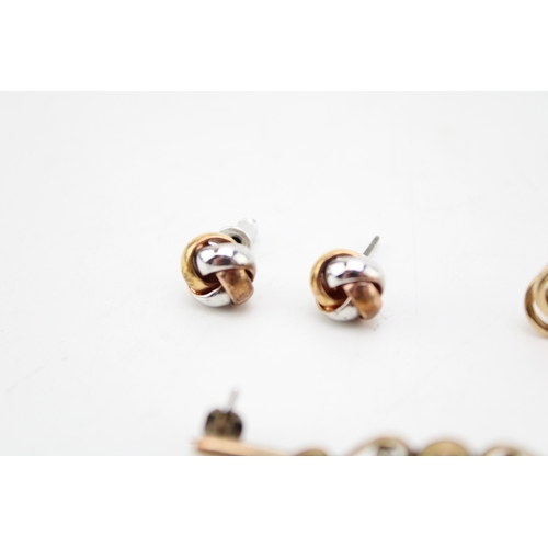 499 - A pair of 9ct gold knot earrings, 1.1g, a pair of tricolour knot earrings, unmarked 3.0g and an unma... 