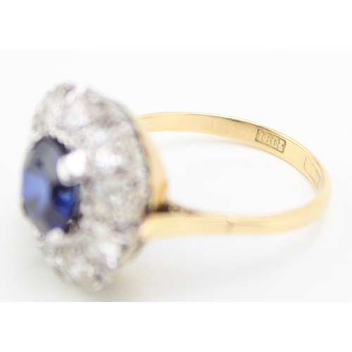 502 - An Art Deco 18ct gold, platinum, sapphire and diamond dress ring, the central deep royal blue sapphi... 