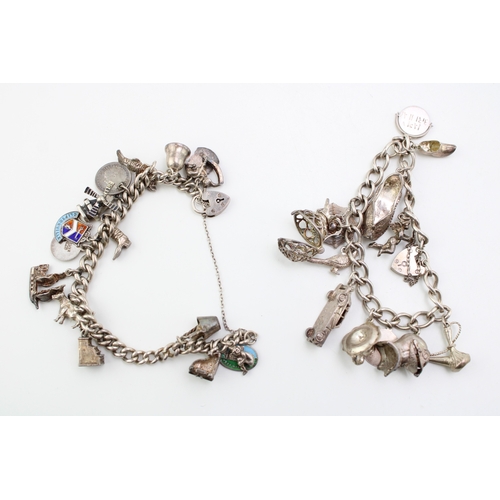 507 - Two silver curb link charm bracelets one with sixteen charms including windmill, hunting boot, rocki... 