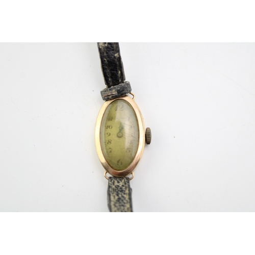 51 - A 9ct yellow gold ladies watch on a leather strap. Gross weight 11.4g.