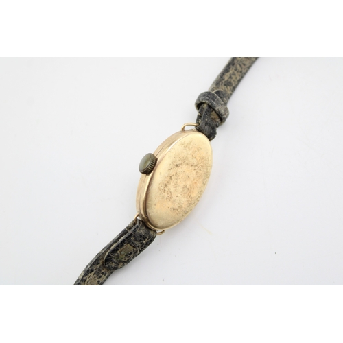 51 - A 9ct yellow gold ladies watch on a leather strap. Gross weight 11.4g.