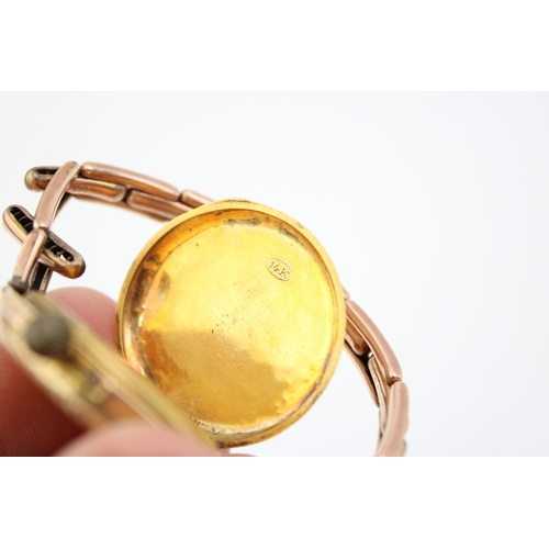 511 - A 14ct gold cased wristwatch, the enamel dial with Roman numerals and foliate detail, likely Contine... 