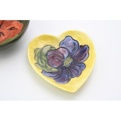 601 - A Moorcroft bowl in the 'Pink Hibiscus' pattern together with a heart shaped pin tray in the 'Clemat... 