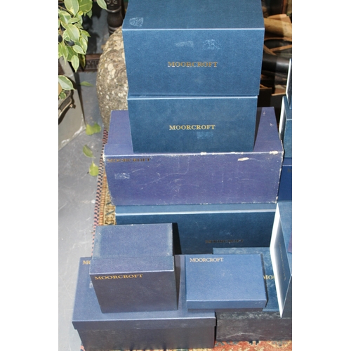 606 - A collection of empty Moorcroft pottery cardboard boxes, the largest being 58cm x 23cm x 23cm and sm... 