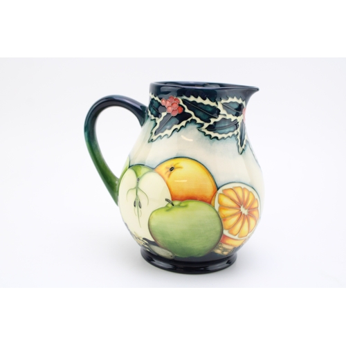 610 - Moorcroft limited edition jug in a festive pattern, 10/20, 15cm tall.