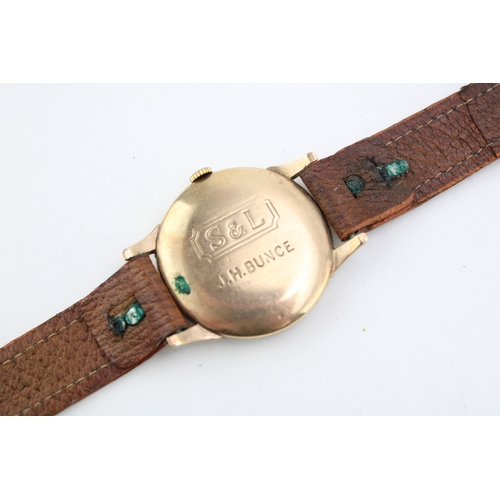 63 - Trebex 9ct gold cased gentleman's wristwatch, leather strap, 34mm wide, winds, ticks, sets and runs.