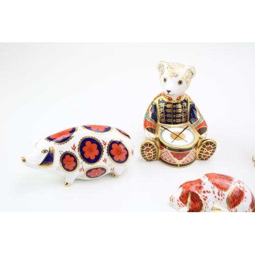 636 - Royal Crown Derby paperweight, Drummer Teddy, 11cm high; together with a Cat, date code for 1999 (LX... 