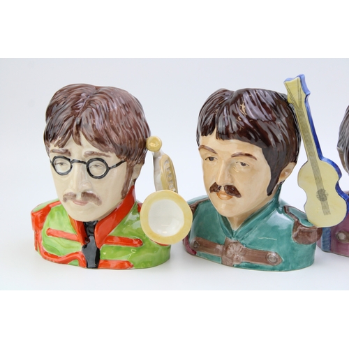 638 - A collection of Peggy Davies The Beatles Pop Legend character jugs, all limited edition of 200 (4).