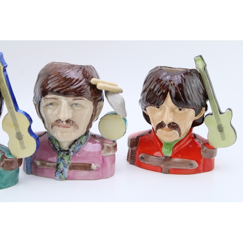 638 - A collection of Peggy Davies The Beatles Pop Legend character jugs, all limited edition of 200 (4).