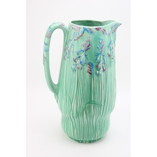 653 - Large Carlton Ware jug, Art Deco form, decorated with Bluebells, 37cm tall (restored).