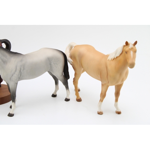 669 - Three Beswick horses, in matte, in grey, palamino and brown 'Spirit of Youth' (3).