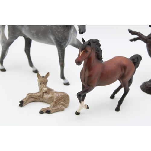 670 - Horse ornaments to include Beswick matte brown Prancing Arab, a Wade Northlight figure, a bronze eff... 