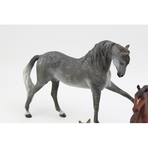 670 - Horse ornaments to include Beswick matte brown Prancing Arab, a Wade Northlight figure, a bronze eff... 