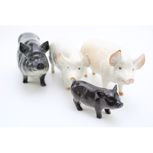 681 - Beswick pigs to include a Vietnamese pig and piglet, with Champion Wall Boy and Champion Wall Queen ... 