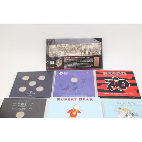 88 - A collection of carded 50p coins to include an Isle of Man Rupert Bear collection, Peter Pan coins, ... 