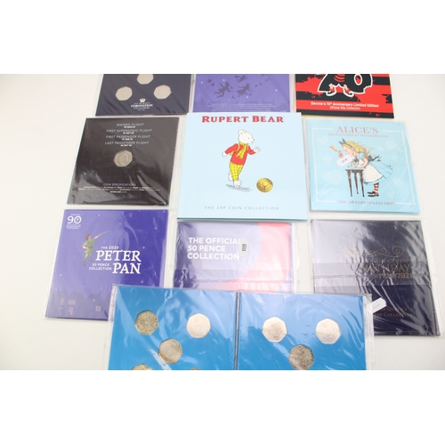 88 - A collection of carded 50p coins to include an Isle of Man Rupert Bear collection, Peter Pan coins, ... 