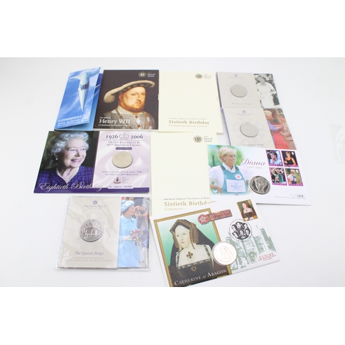 94 - A collection of carded coins to include 3 £5 Queen's Reign Royal Mint coins, Diana 1 Crown coin, Cat... 