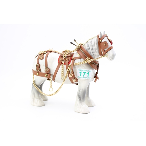 171 - A Beswick Shire horse in working harness, 21.5cm tall.