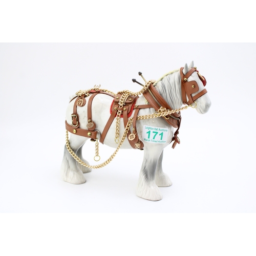 171 - A Beswick Shire horse in working harness, 21.5cm tall.