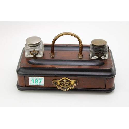 187 - An antique desk inkwell set with drawer, width 25cm.