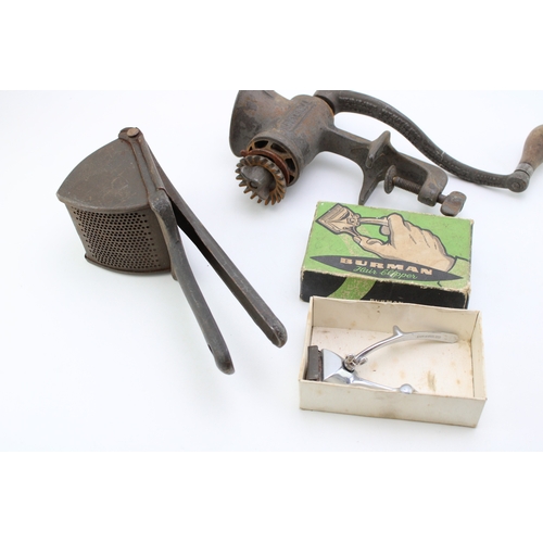 194 - a vintage mincer, potato ricer and a razor in a box