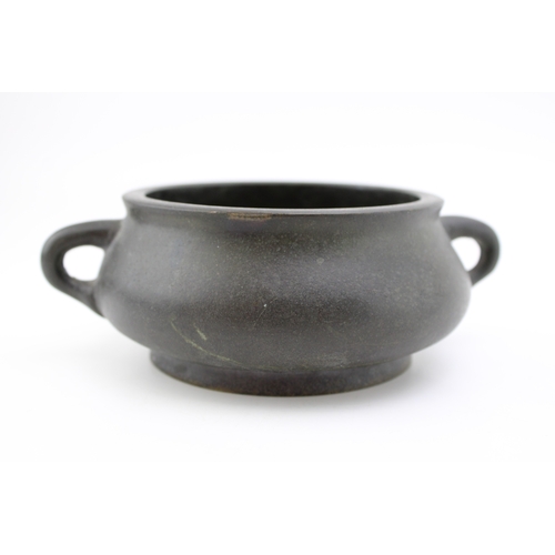 1151 - Chinese bronze censor, loop handled, Qing period, Xuande character mark, 17cm diameter.