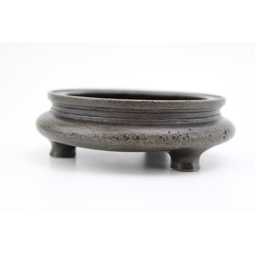 1153 - Chinese bronze three-footed censor, Qing Period, 11cm diameter.