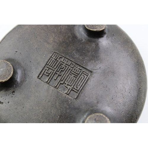 1153 - Chinese bronze three-footed censor, Qing Period, 11cm diameter.