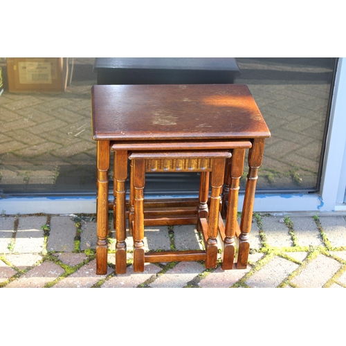 1164 - Oak nest of tables, late 20th century, carved decoration, largest 48cm x 33cm x 49cm (3).