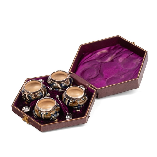 195 - Four Doulton Lambeth stoneware salt cellars, in fitted velvet-lined presentation case, silver rims, ... 