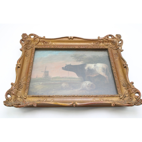 94 - Paulus Potter, a follower of, oil on canvas of a cow and two sheep, with church spire in the backgro... 