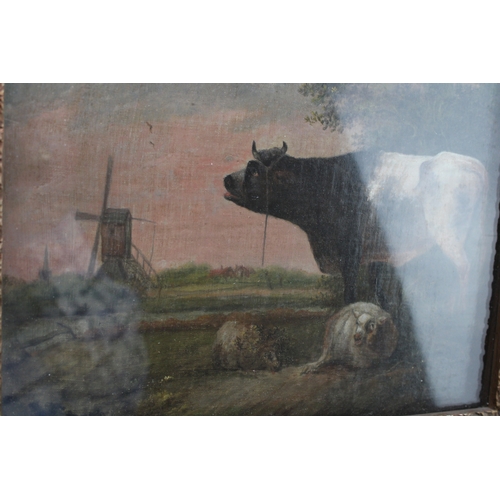 94 - Paulus Potter, a follower of, oil on canvas of a cow and two sheep, with church spire in the backgro... 