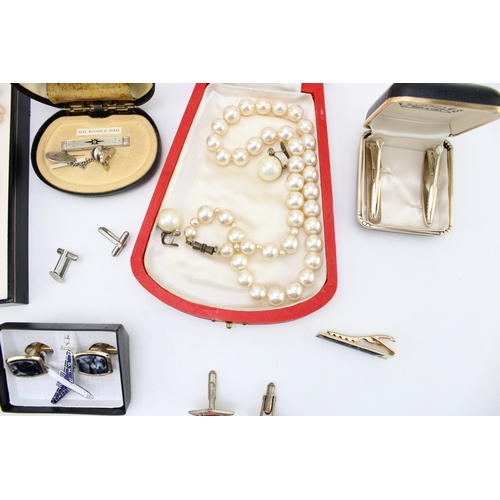 1 - A group of vintage costume jewellery comprising two strings of simulated pearls, both boxed, a pair ... 