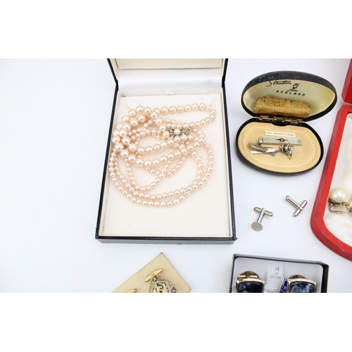 1 - A group of vintage costume jewellery comprising two strings of simulated pearls, both boxed, a pair ... 