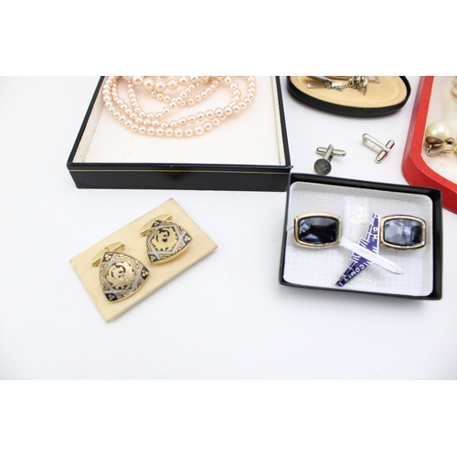 1 - A group of vintage costume jewellery comprising two strings of simulated pearls, both boxed, a pair ... 