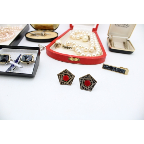 1 - A group of vintage costume jewellery comprising two strings of simulated pearls, both boxed, a pair ... 