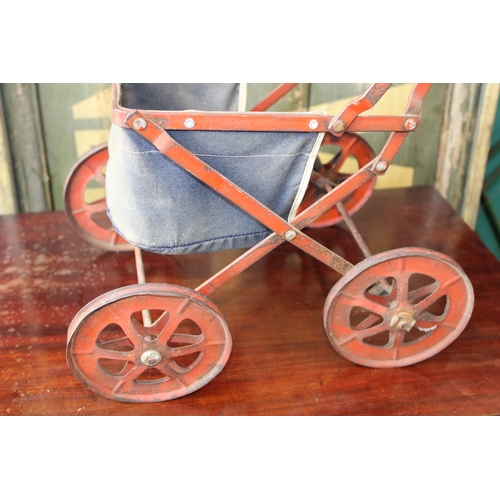 12 - Child's baby doll pram in pressed steel with folding frame, c1930s, 63cm tall.