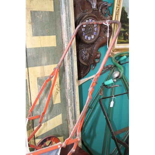 12 - Child's baby doll pram in pressed steel with folding frame, c1930s, 63cm tall.