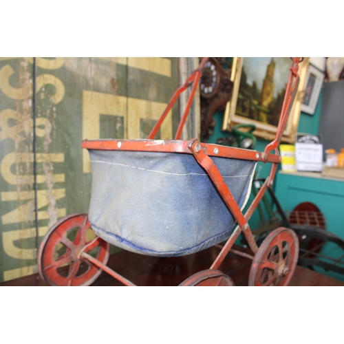 12 - Child's baby doll pram in pressed steel with folding frame, c1930s, 63cm tall.