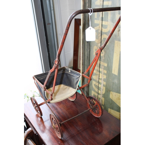 12 - Child's baby doll pram in pressed steel with folding frame, c1930s, 63cm tall.