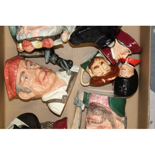 129 - Large Royal Doulton character jugs to include Tam o'Shanter, Porthos and others with small jugs (8).