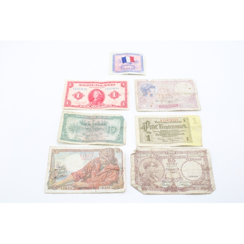 138 - A collection of WWII era banknotes to include French Francs, Belgium Francs and other similar exampl... 