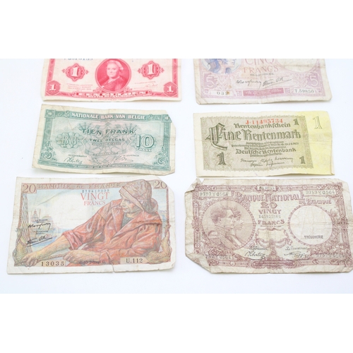138 - A collection of WWII era banknotes to include French Francs, Belgium Francs and other similar exampl... 