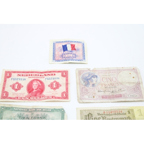 138 - A collection of WWII era banknotes to include French Francs, Belgium Francs and other similar exampl... 
