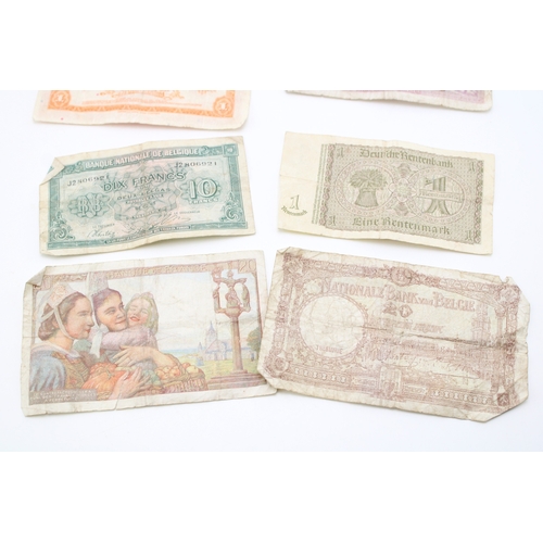 138 - A collection of WWII era banknotes to include French Francs, Belgium Francs and other similar exampl... 