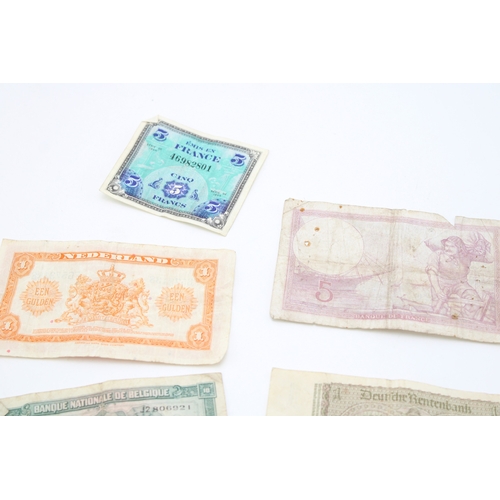 138 - A collection of WWII era banknotes to include French Francs, Belgium Francs and other similar exampl... 